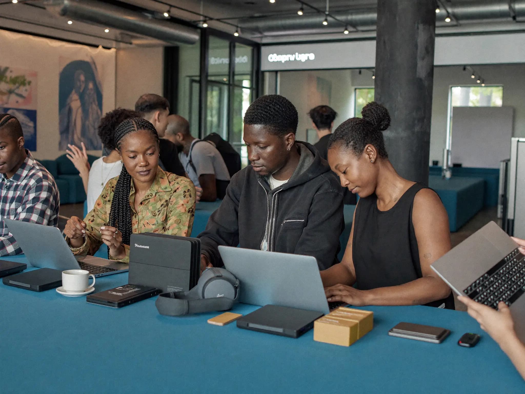 African creators collaborating in a workspace